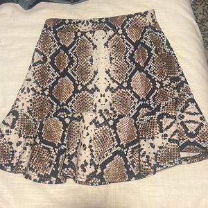 Snakeskin body con skirt with peplum